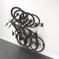 StoreYourBoard SwivelStow Bike Storage Rack 4 Pack, 2 MTB & 2 Road & Gravel Bike Wall Mounts, Heavy Duty Bike Hanger, No-Lift Bike Wall Mount for Garage Bike Storage, Holds 70 lbs, Patent-Pending